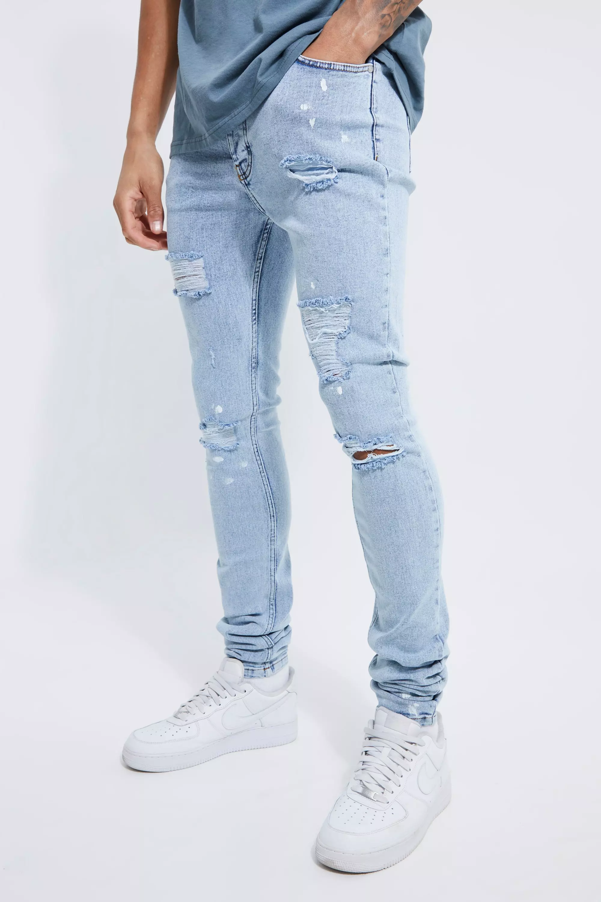 Paint splatter ripped hot sale jeans mens